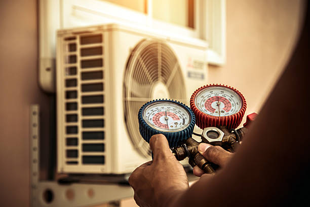Professional Heat Pump Repair technician working in Caroga Lake, NY